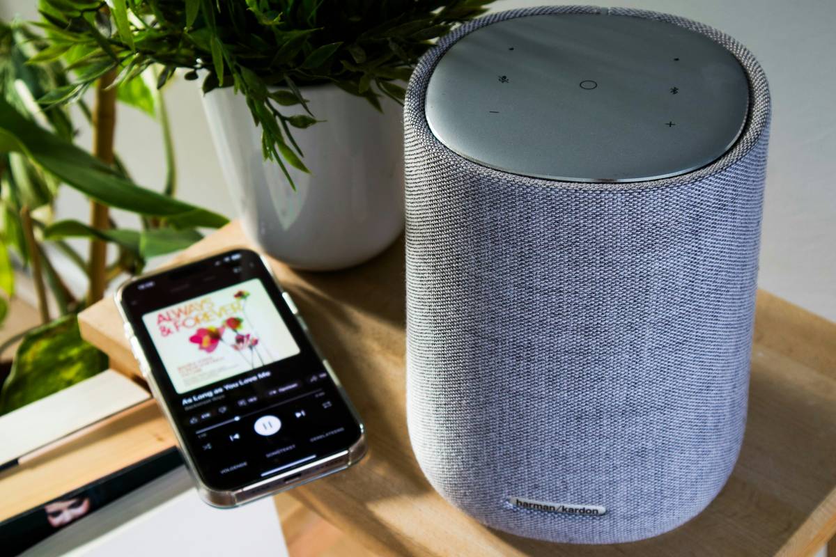 Smart home speakers helpful setup in a modern living room with integrated lighting and thermostat controls